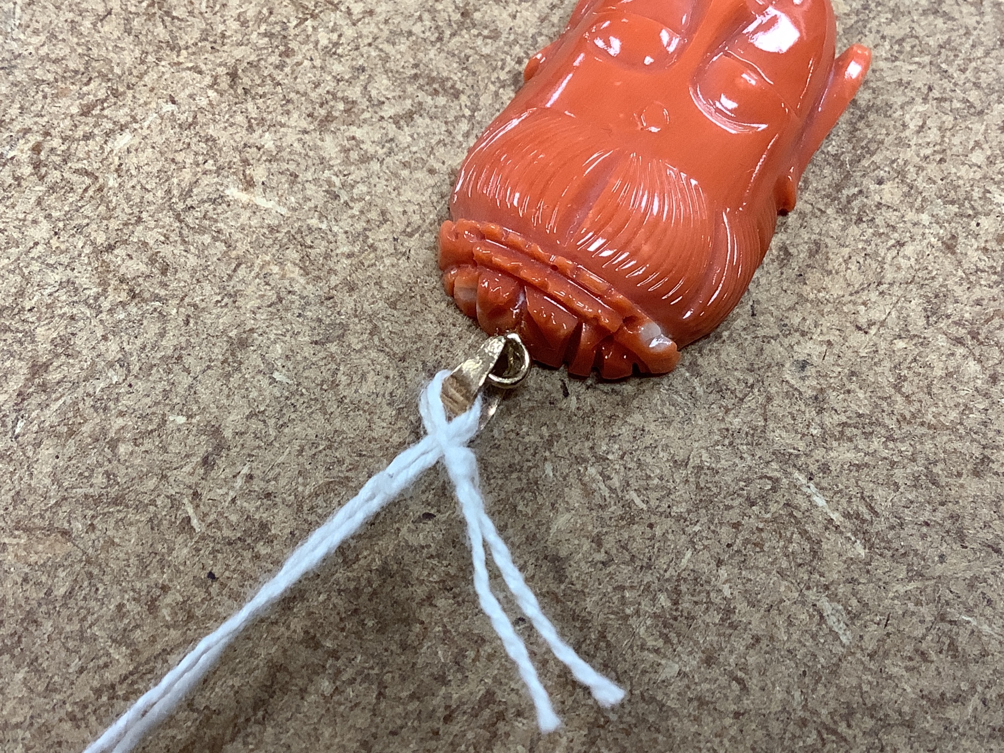 A Chinese 14k yellow metal mounted carved coral pendant, 35mm, gross weight 8.9 grams.